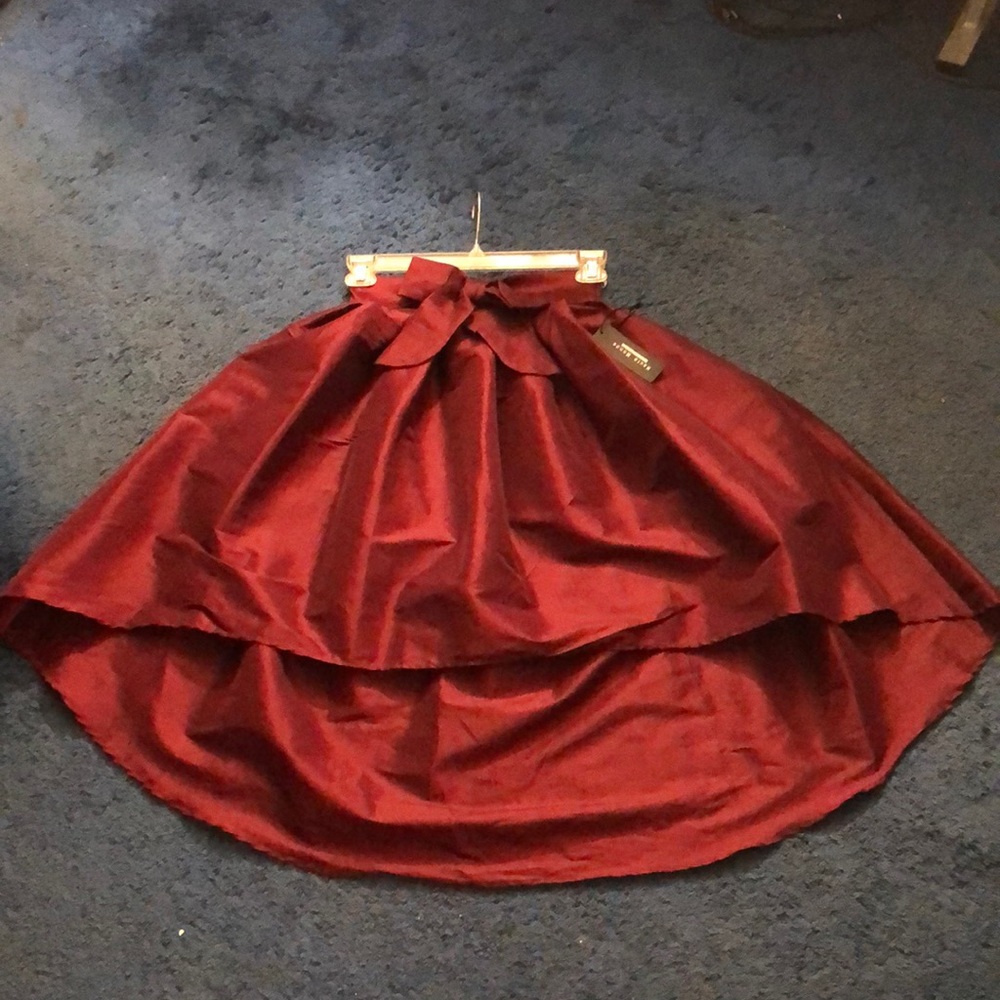 Burgundy skirt.